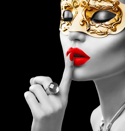 48215590 - beauty model woman wearing venetian masquerade carnival mask at party