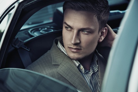 9680844 - handsome man in car