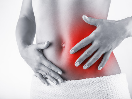 56636491 - woman with stomach pain isolated on white background